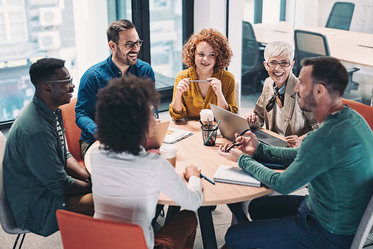 people having a discussion at a table
